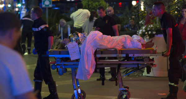 epa05425172 Wounded people are evacuated from the scene where a truck crashed into the crowd during the Bastille Day celebrations in Nice, France, 14 July 2016. According to reports, at least 70 people died and many were wounded after a truck drove into the crowd on the famous Promenade des Anglais during celebrations of Bastille Day. Anti-terrorism police took over the investigation in the incident, media added. EPA/OLIVIER ANRIGO